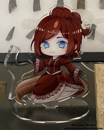 Acrylic standee of our Spinosaurus anime girl mascot in front of a fossil display.